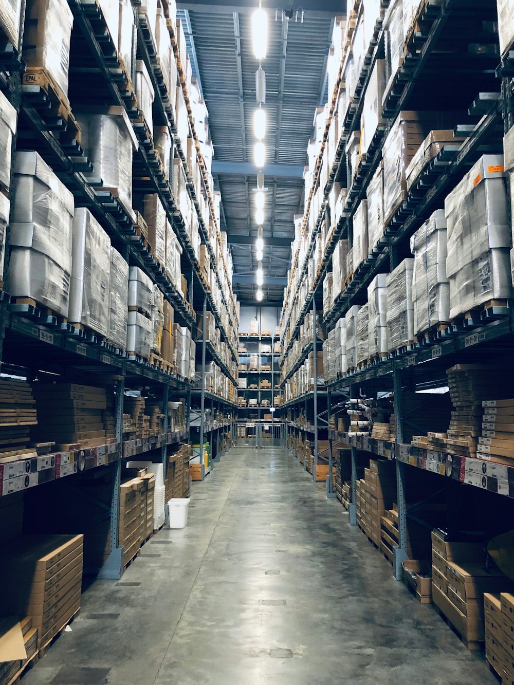 Warehouse aisle stacked with inventory