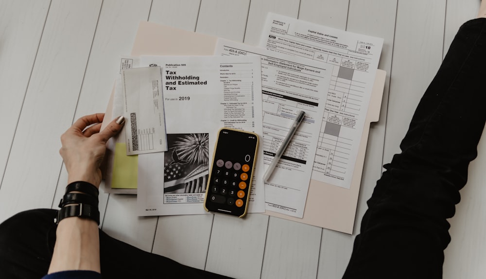 Financial paperwork and a calculator on a desk